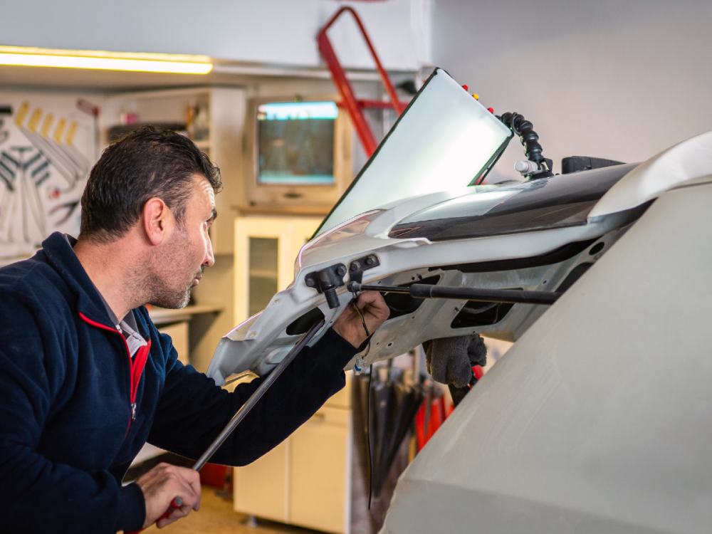 Technician doing dent repairs
