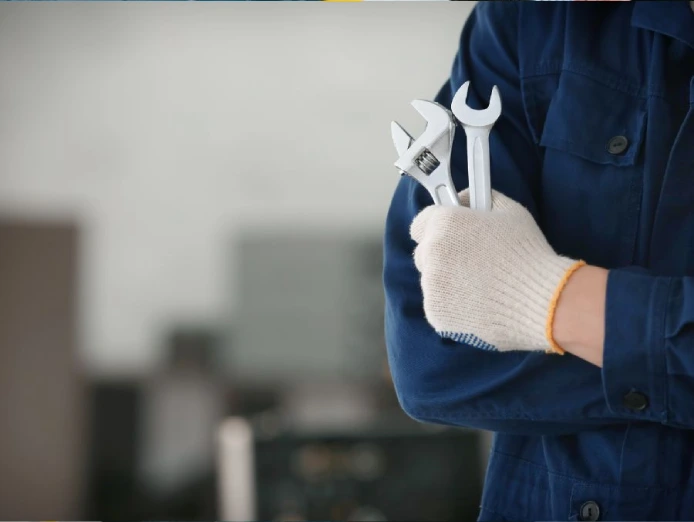man holding car repair tools