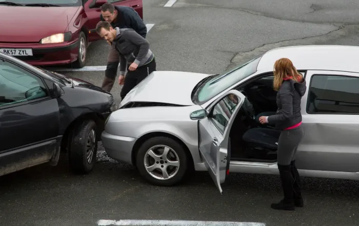 a few drivers checking out a multi-vehicle collision